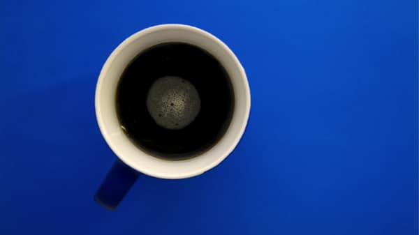 black coffee on a blue background