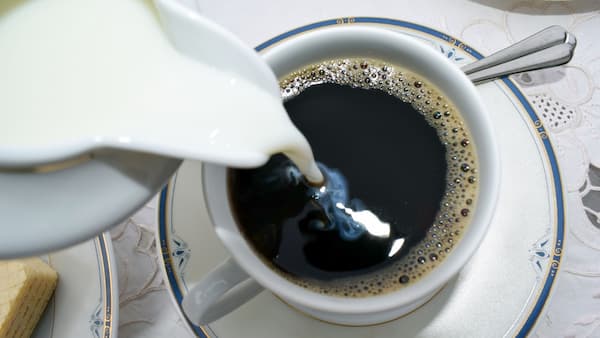 creamy coffee being poured