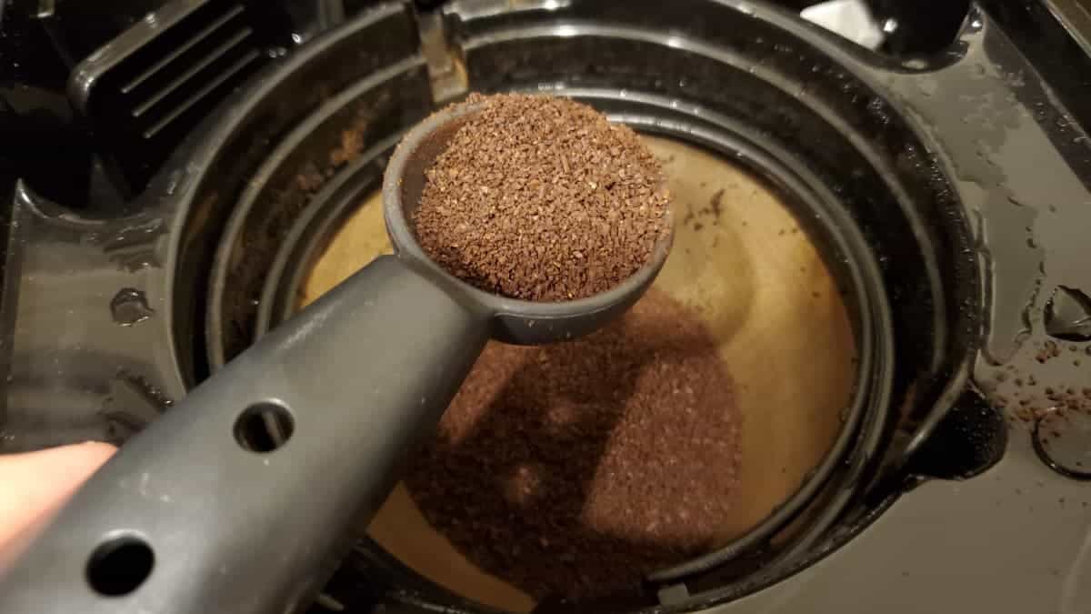 scooping ground drip coffee